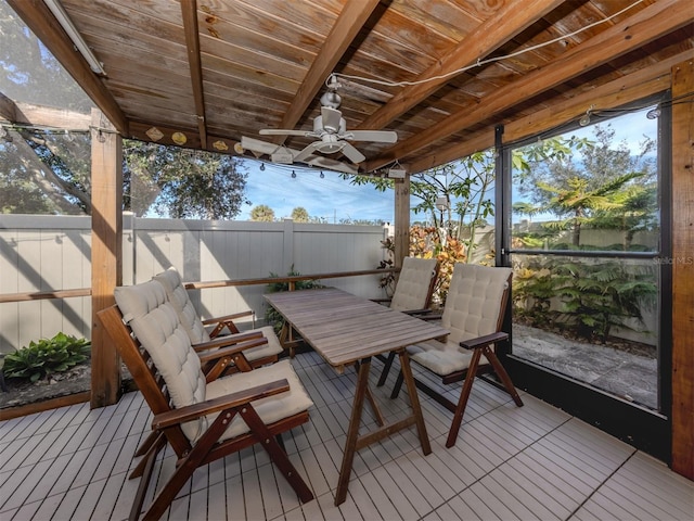 sunroom / solarium with ceiling fan