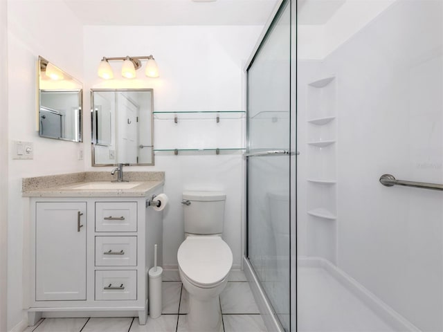 bathroom with vanity, toilet, and walk in shower