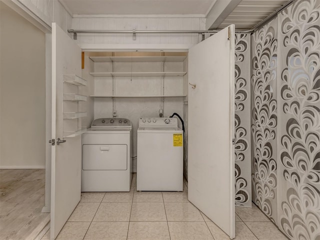 washroom with light tile patterned floors and independent washer and dryer