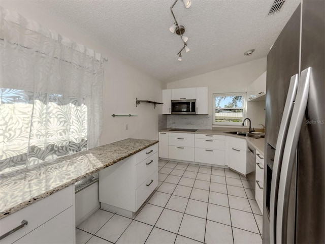 kitchen featuring white cabinetry, stainless steel appliances, and sink