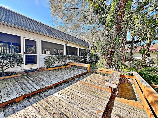 wooden terrace with a sunroom