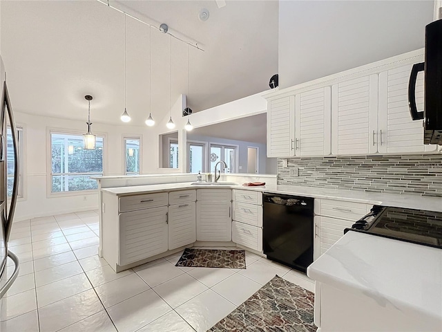 kitchen with pendant lighting, black appliances, white cabinetry, sink, and kitchen peninsula