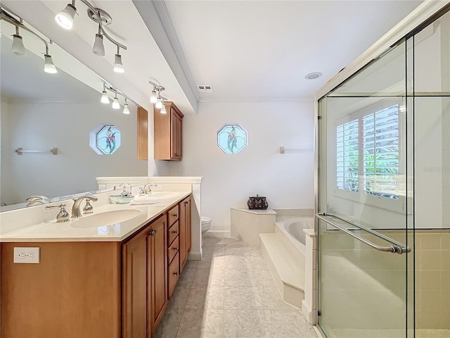 full bathroom featuring vanity, shower with separate bathtub, tile patterned floors, and toilet