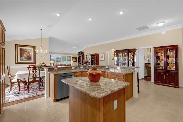 kitchen with vaulted ceiling, a kitchen island, dishwasher, hanging light fixtures, and kitchen peninsula