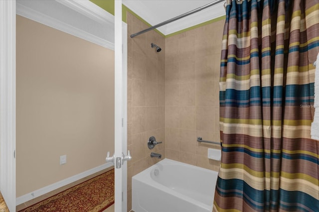 bathroom featuring crown molding and shower / tub combo with curtain