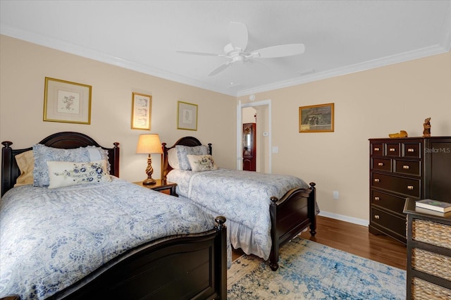 bedroom with ornamental molding, wood-type flooring, and ceiling fan