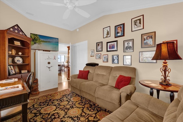 living room with lofted ceiling, hardwood / wood-style floors, and ceiling fan