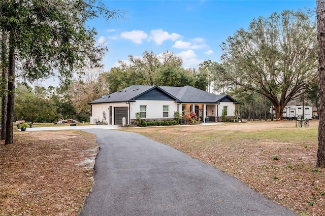 single story home with a garage