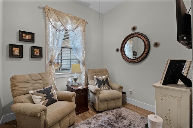 sitting room featuring light hardwood / wood-style flooring