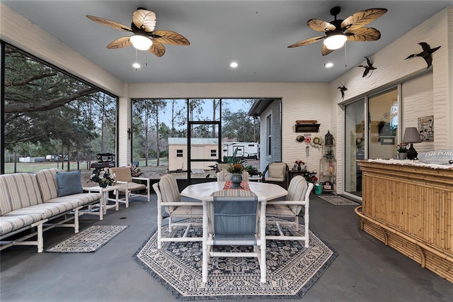 sunroom / solarium with ceiling fan