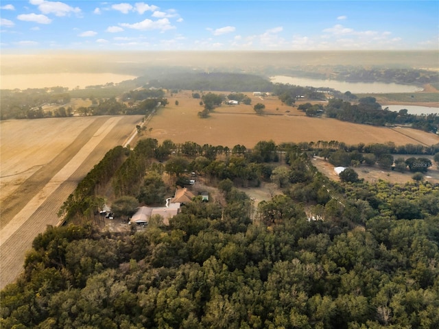 drone / aerial view with a rural view and a water view