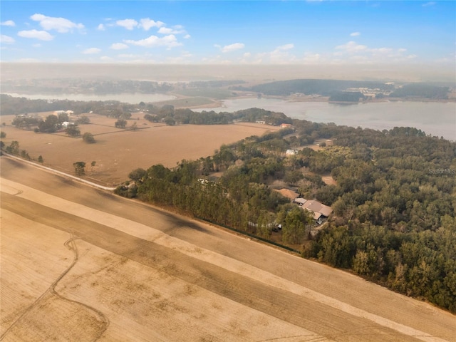 drone / aerial view with a rural view and a water view