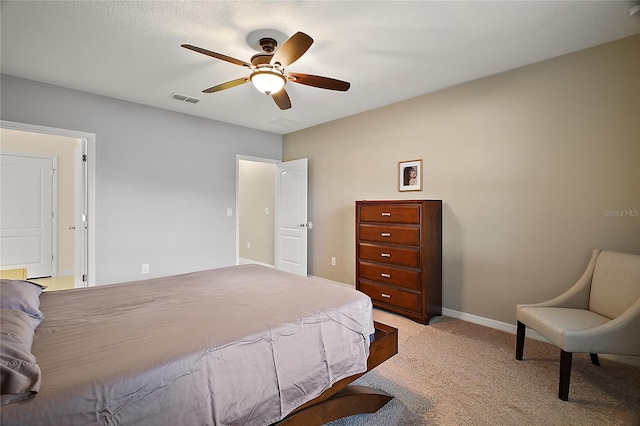 bedroom with ceiling fan and light colored carpet