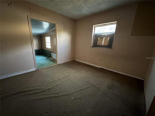 spare room featuring a textured ceiling