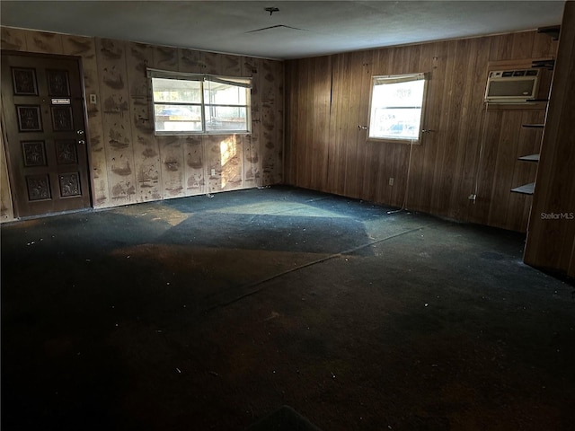 spare room with plenty of natural light and a wall mounted AC