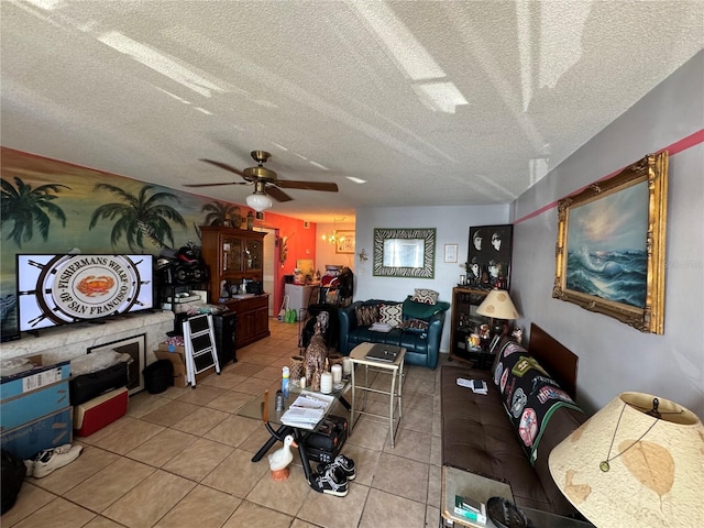 tiled living room with ceiling fan and a textured ceiling