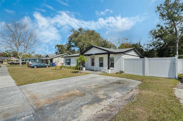 ranch-style home featuring a front yard and a porch