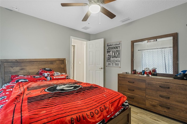 bedroom featuring light hardwood / wood-style flooring and ceiling fan