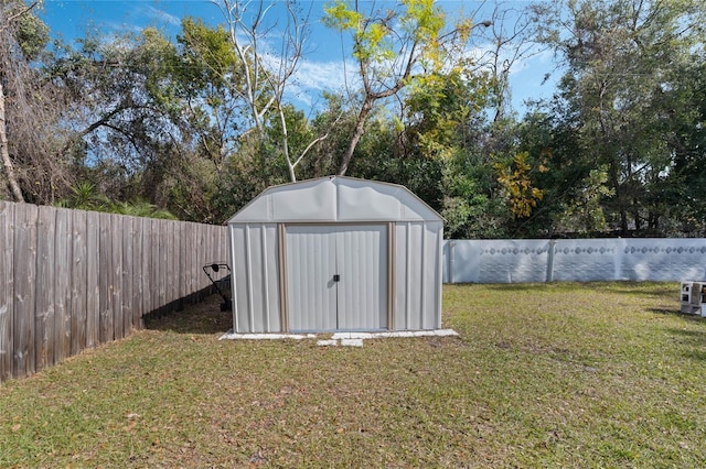 view of outdoor structure with a lawn