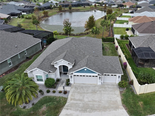 birds eye view of property with a water view