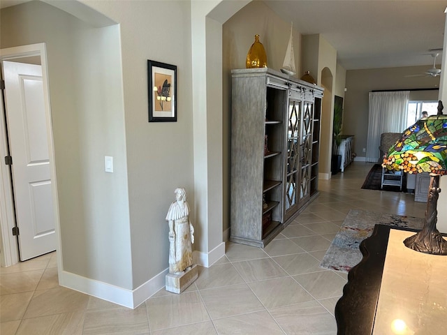 hallway with light tile patterned floors