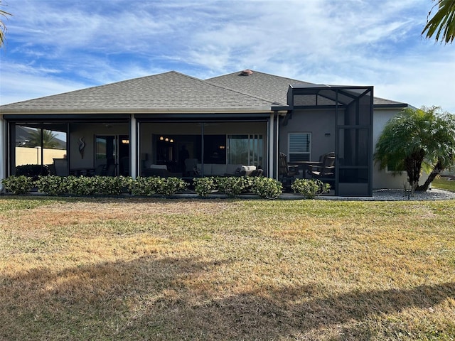 rear view of house with a yard