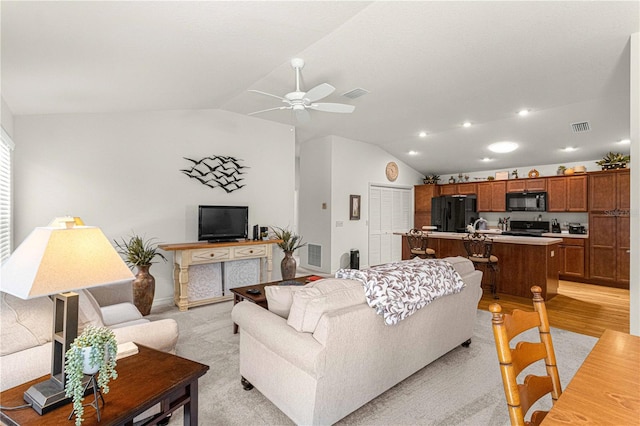 living room with lofted ceiling and ceiling fan