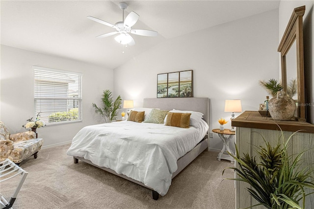 bedroom with vaulted ceiling, light carpet, and ceiling fan