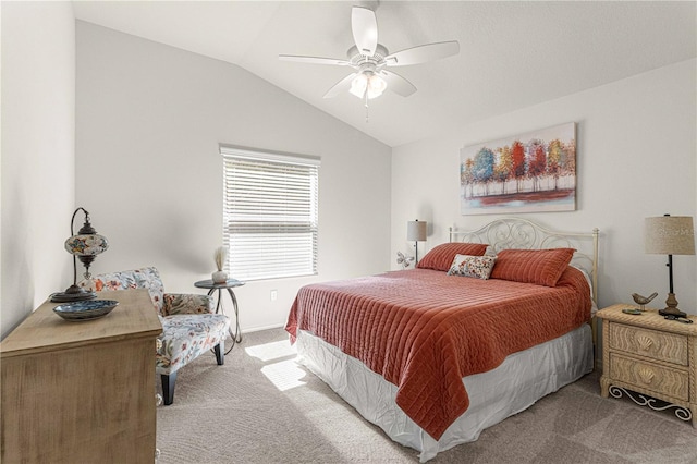 bedroom featuring vaulted ceiling, carpet floors, and ceiling fan