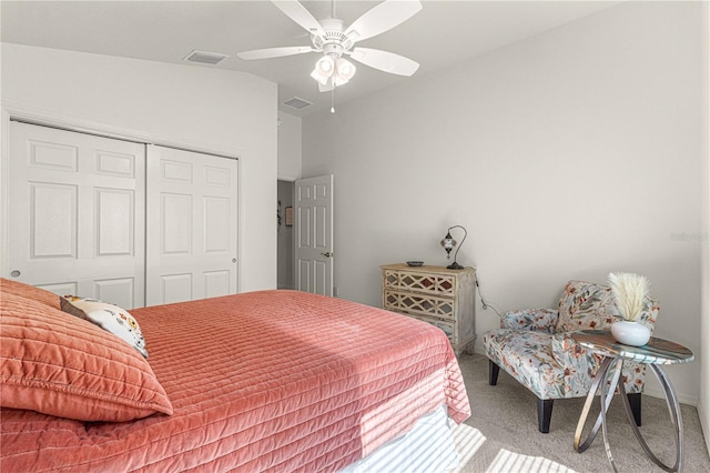 bedroom featuring vaulted ceiling, carpet flooring, ceiling fan, and a closet