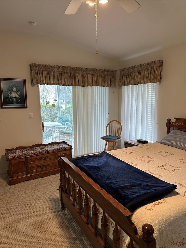 carpeted bedroom with vaulted ceiling and ceiling fan