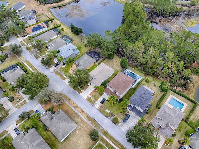 drone / aerial view featuring a water view and a residential view