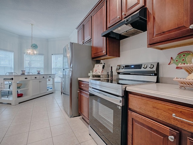 kitchen featuring ornamental molding, stainless steel appliances, light countertops, under cabinet range hood, and pendant lighting