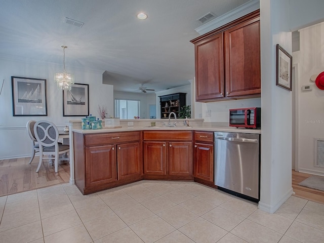 kitchen featuring light countertops, stainless steel dishwasher, a sink, and visible vents