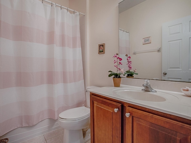 bathroom with toilet, shower / bathtub combination with curtain, vanity, and tile patterned floors