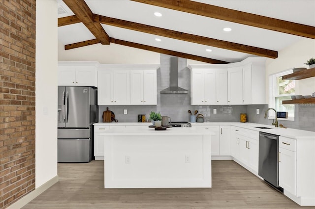 kitchen with open shelves, wall chimney range hood, stainless steel appliances, and light countertops