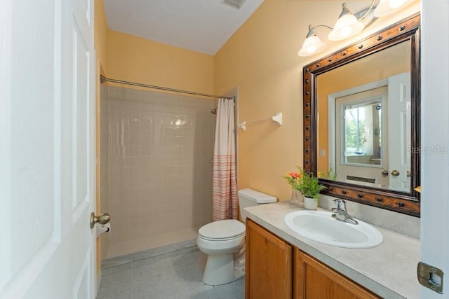 bathroom with visible vents, a shower stall, toilet, and vanity