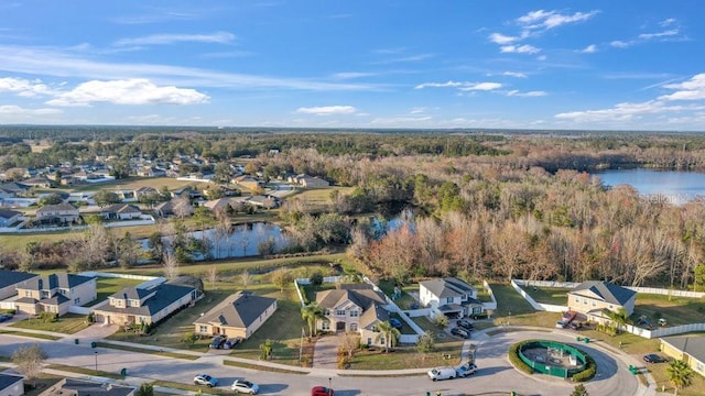 drone / aerial view with a residential view and a water view