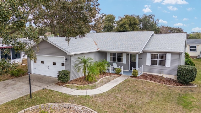 single story home with a garage, covered porch, and a front lawn