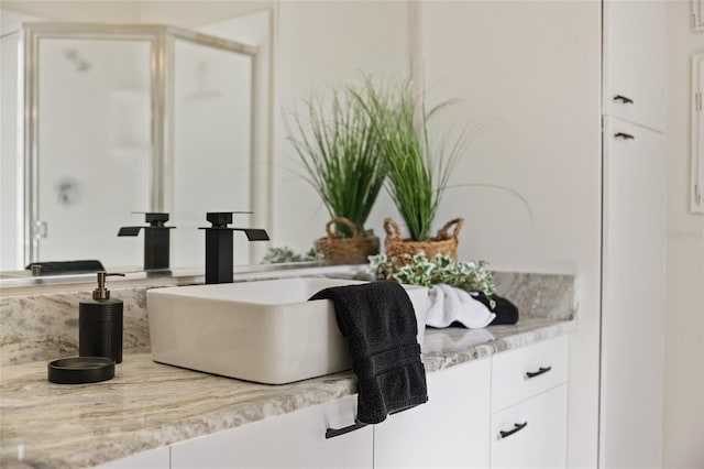 bathroom featuring vanity and walk in shower