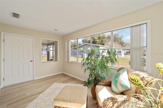 sitting room with light hardwood / wood-style floors