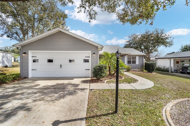 single story home with a garage and a front yard