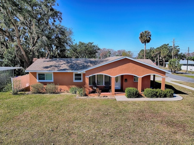 single story home with a front yard