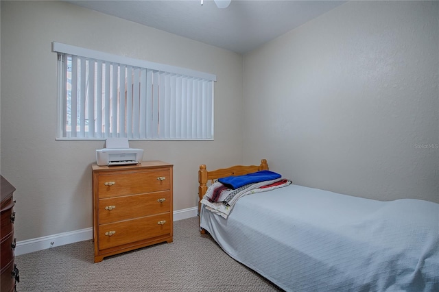 bedroom with light colored carpet and ceiling fan