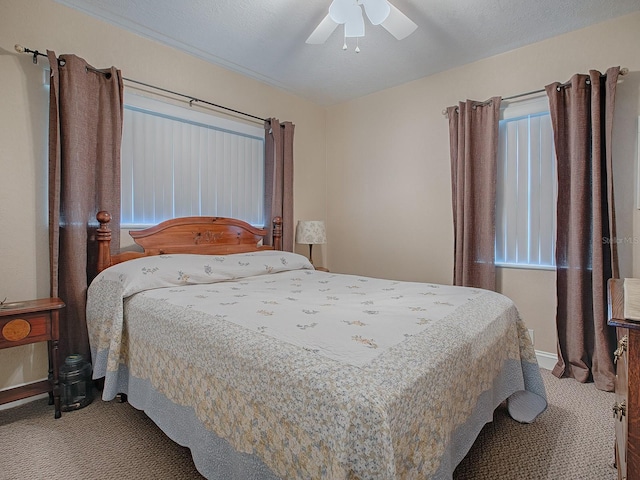 bedroom with ceiling fan and carpet floors