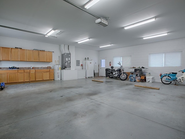 garage with white refrigerator, a garage door opener, water heater, and heating unit