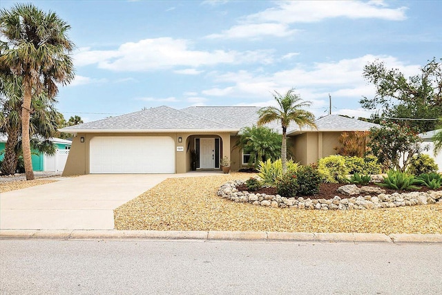 ranch-style house featuring a garage