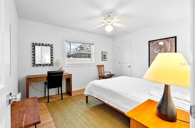 bedroom with hardwood / wood-style flooring and ceiling fan