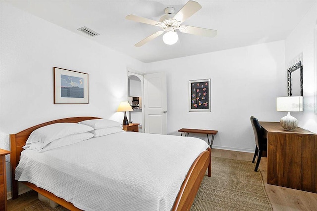 bedroom featuring hardwood / wood-style flooring and ceiling fan