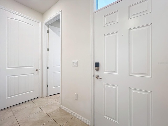 corridor with light tile patterned floors